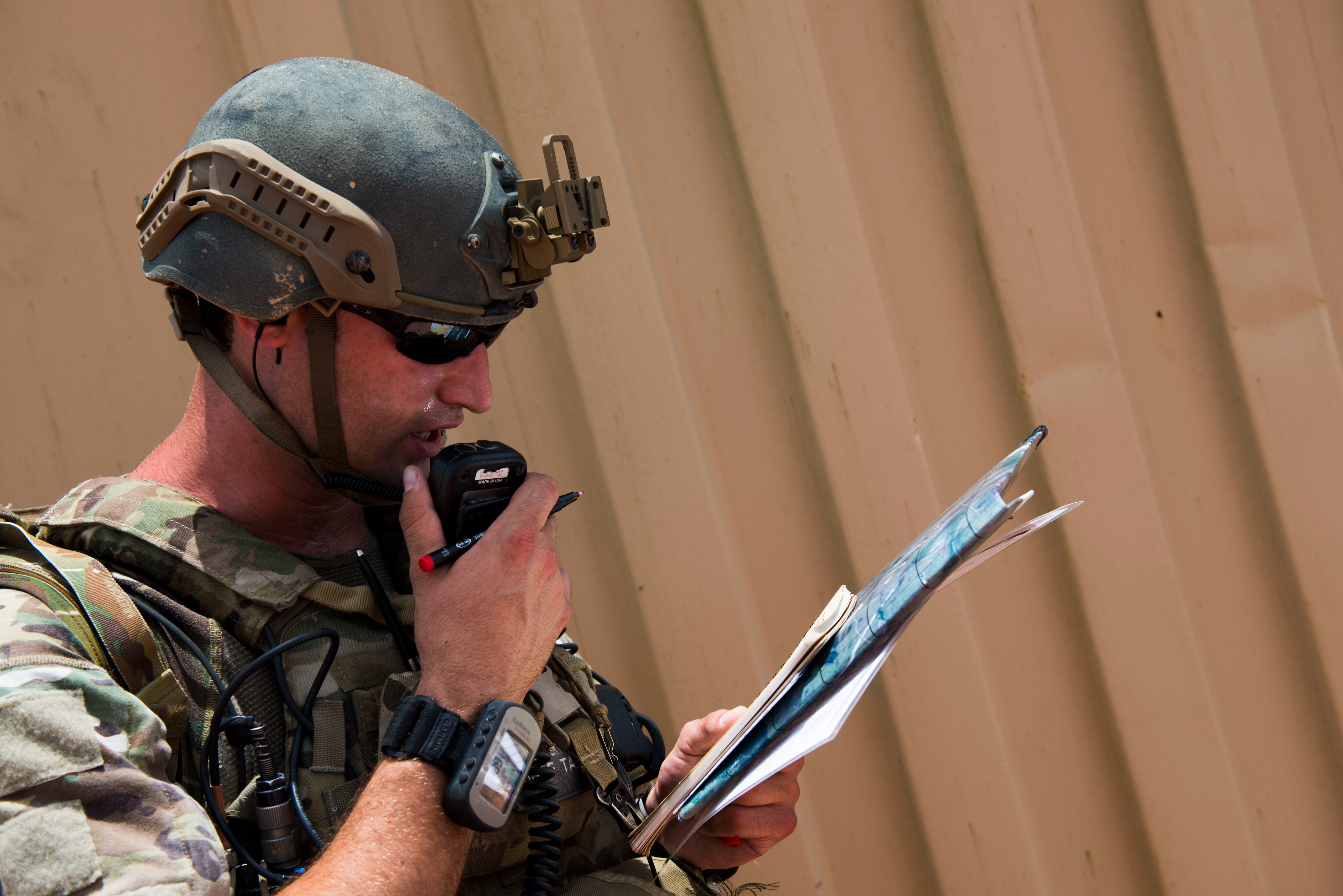 U.S. Air Force Staff Sgt. Robert Cooch delivers attack coordinates to B-52 bomber pilots during Exercise Dragon Strike in June 2015 at Avon Park Air Force Range, Florida.