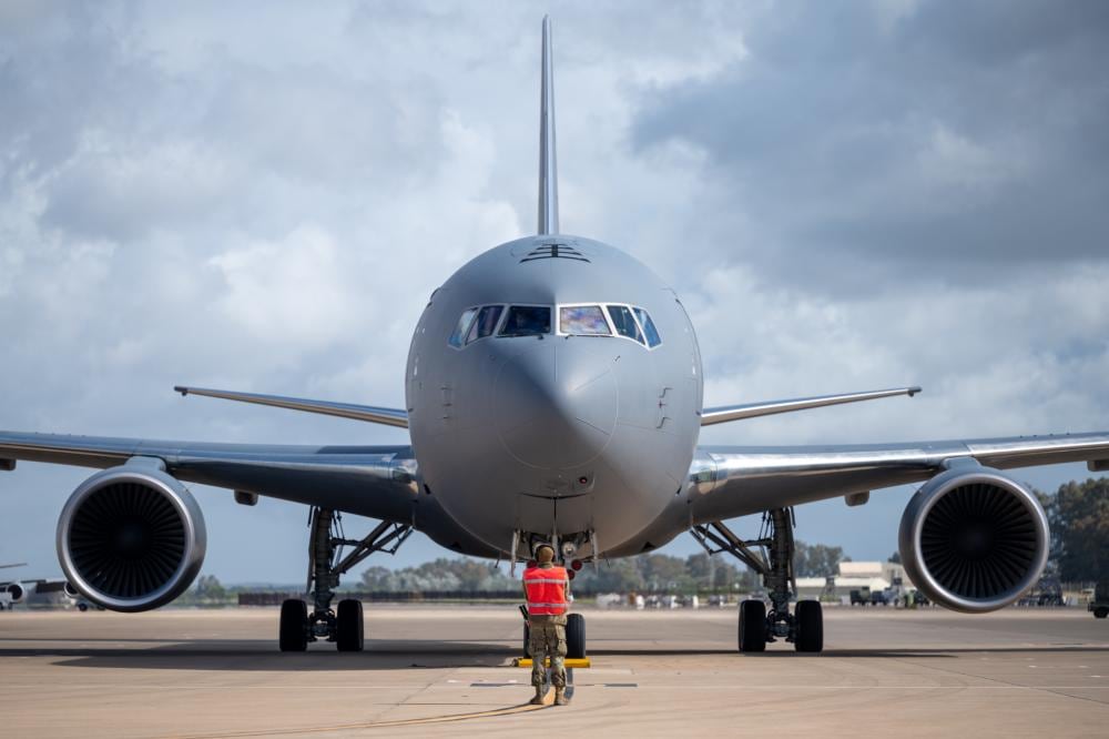 Senior Airman Ike Mendonez, 22nd Maintenance Squadron aerospace propulsion journeyman, observes as a KC-46A Pegasus starts its engines April 12, 2022, at Morón Air Base, Spain. (Staff Sgt. Nathan Eckert/Air Force)