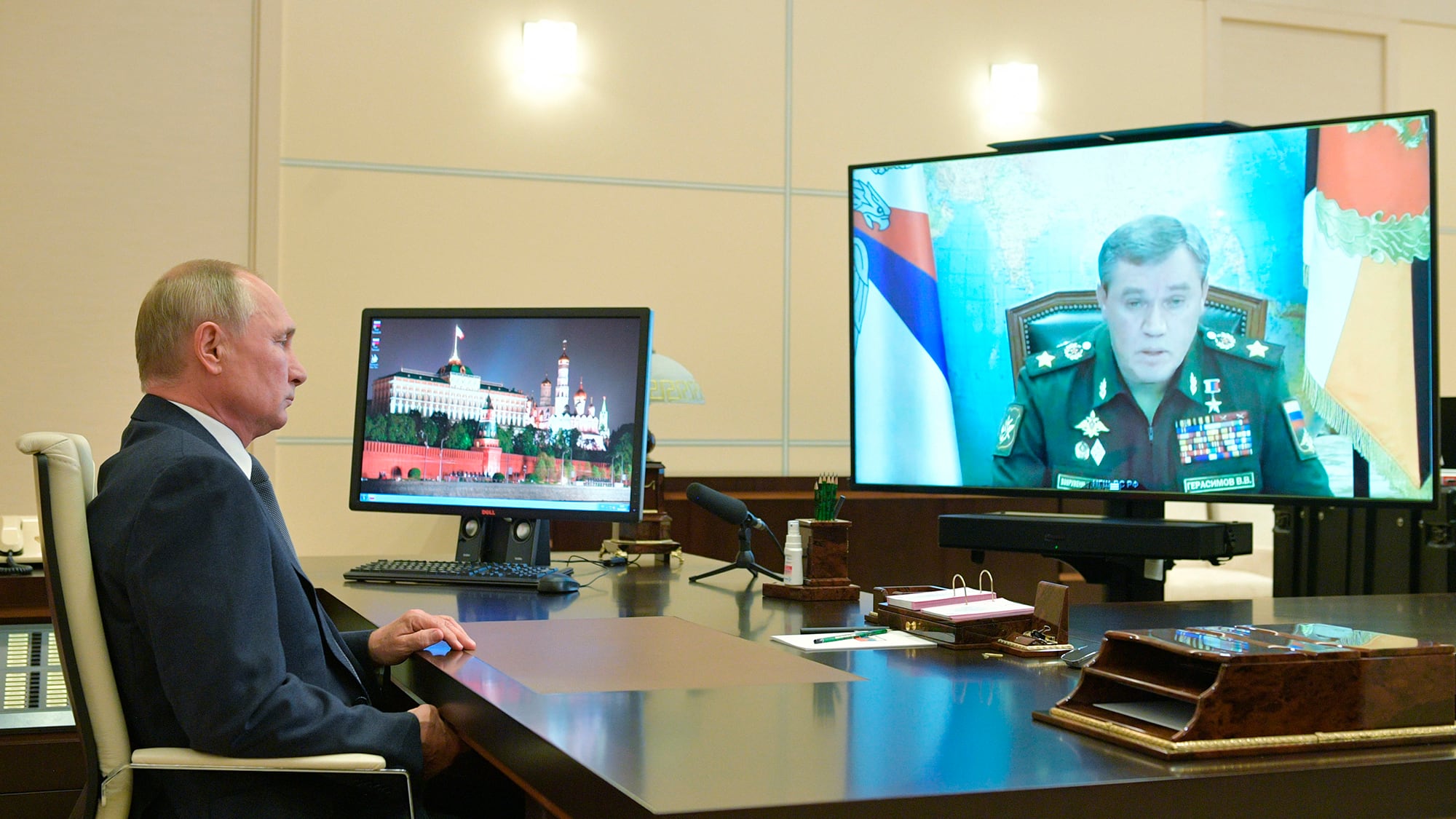 Russian President Vladimir Putin listens to General Staff chief Valery Gerasimov during a video conference at the Novo-Ogaryovo residence outside Moscow on Oct. 7, 2020.