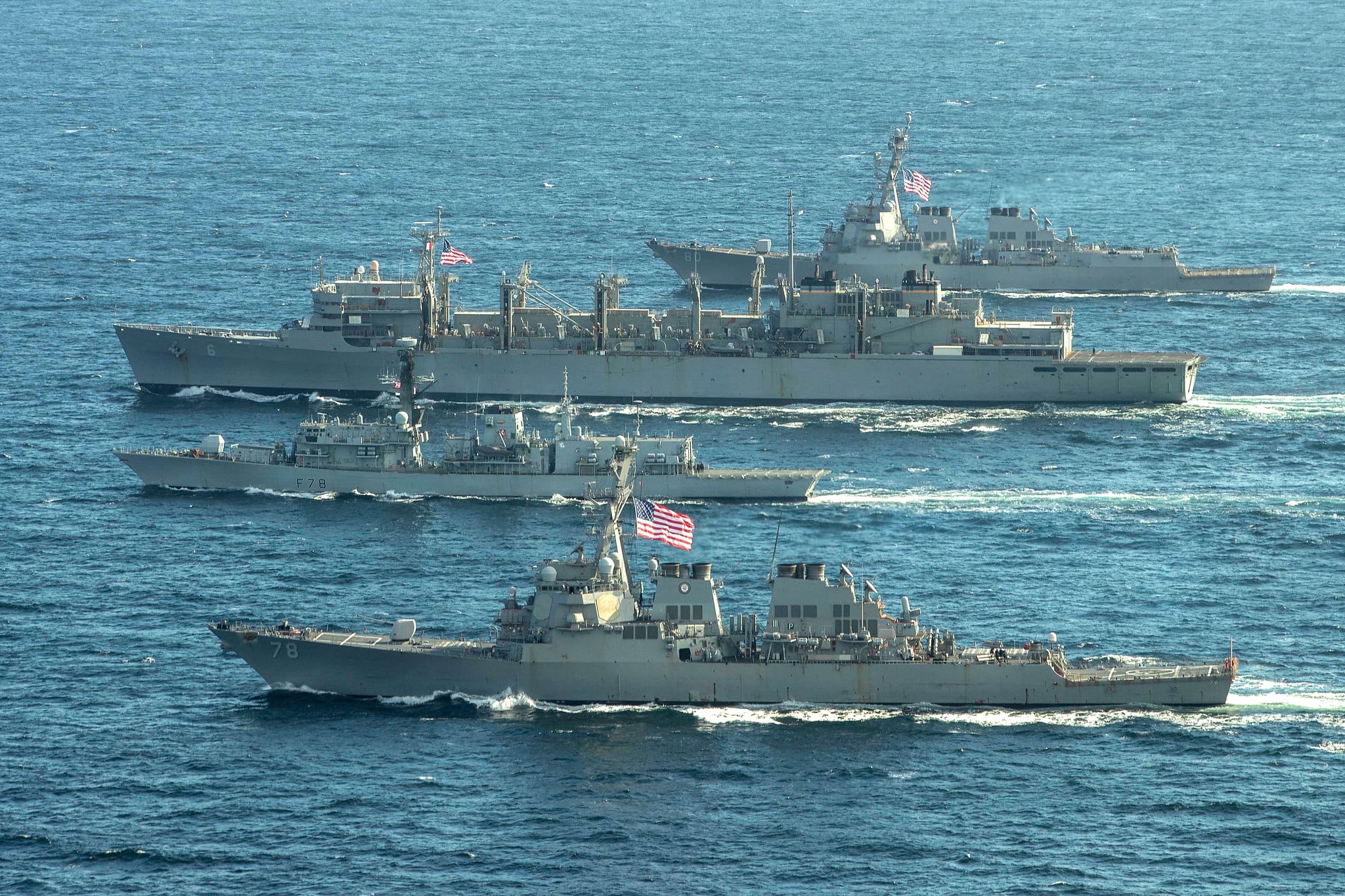 The Arleigh Burke-class guided-missile destroyer USS Porter (DDG 78), front, the Royal Navy Type-23 Duke-class frigate HMS Kent (F78), the fast combat support ship USNS Supply (T-AOE 6) and USS Roosevelt (DDG 80) conduct joint operations to ensure maritime security in the Arctic Ocean, May 5, 2020.