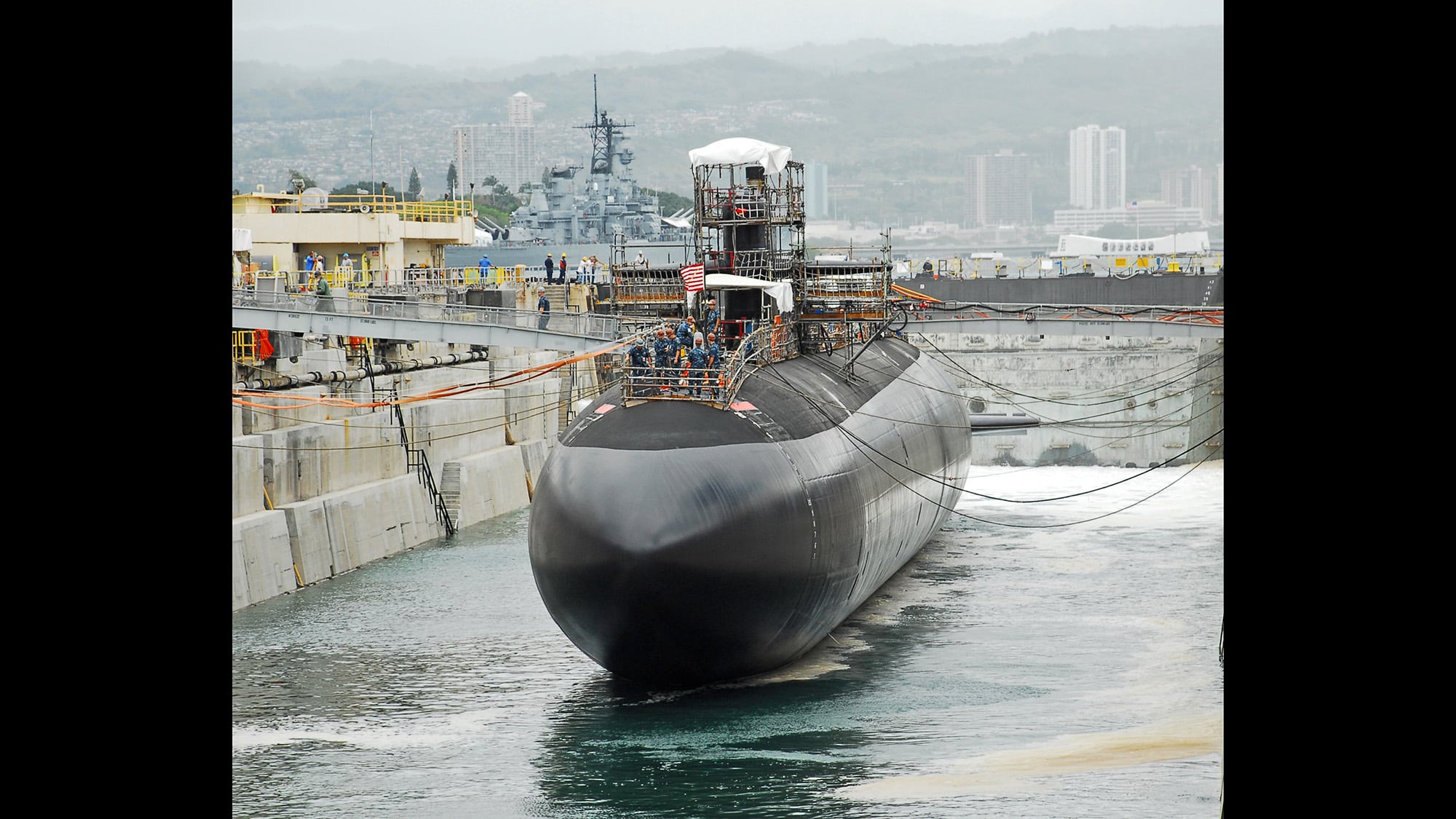 Dry Dock 1 at Pearl Harbor Naval Shipyard is flooded during the undocking of the Los Angeles-class fast attack submarine USS City of Corpus Christi (SSN 705) on May 18, 2010.