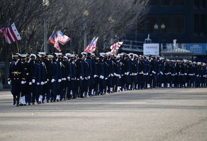 An honor guard deploys to line up along Pennsylvania Avenue in front of the White House in Washington on Jan. 20, 2021.