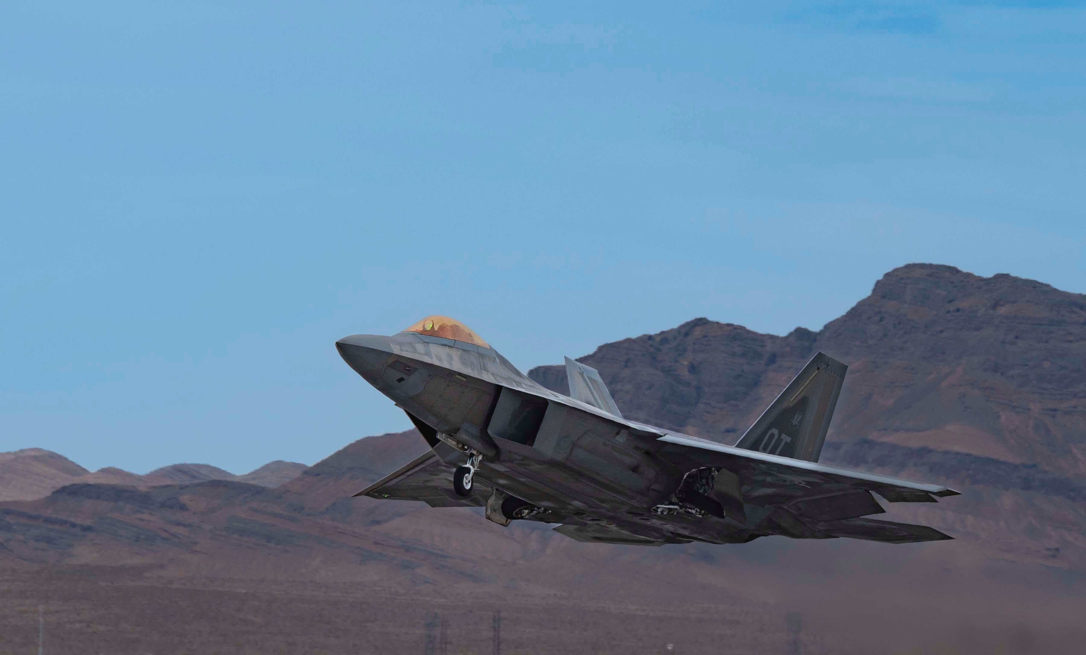 An F-22 Raptor takes off during Black Flag 22-1 at Nellis Air Force Base, Nevada. Black Flag 22-1 investigates electronic warfare techniques and future programming.