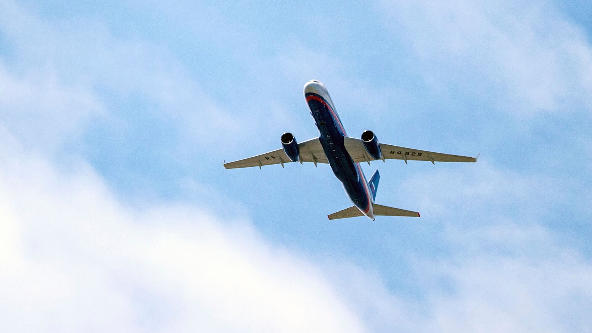 A Russian Air Force Tu-214 flies over Offutt Air Force Base on April 26, 2019, in Omaha, Neb. The flight is allowed as part of the Open Skies Treaty.