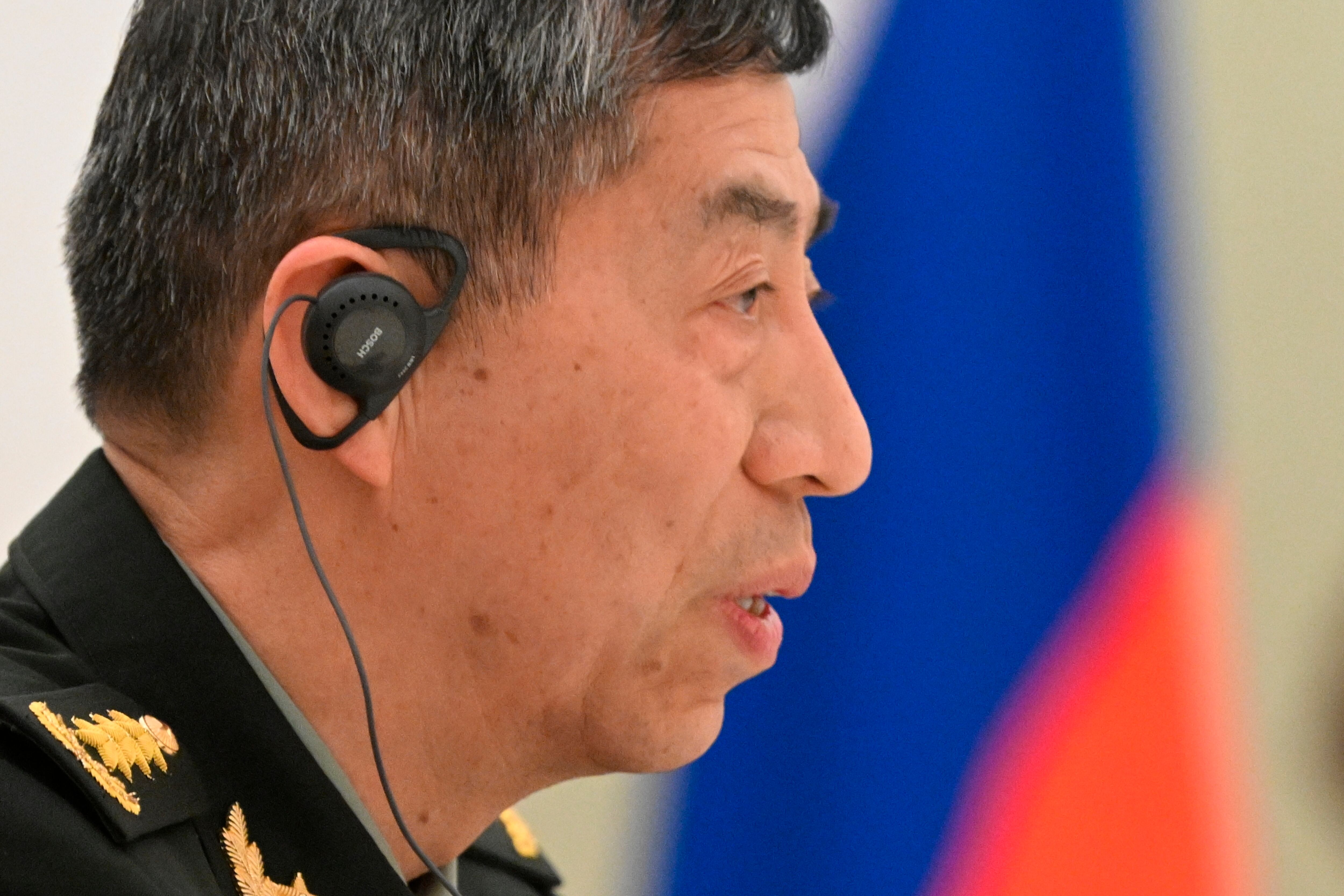 China's Defense Minister Gen. Li Shangfu speaks to Russian President Vladimir Putin and Russian Defense Minister Sergei Shoigu during their meeting at the Kremlin in Moscow, Russia, on April 16, 2023.