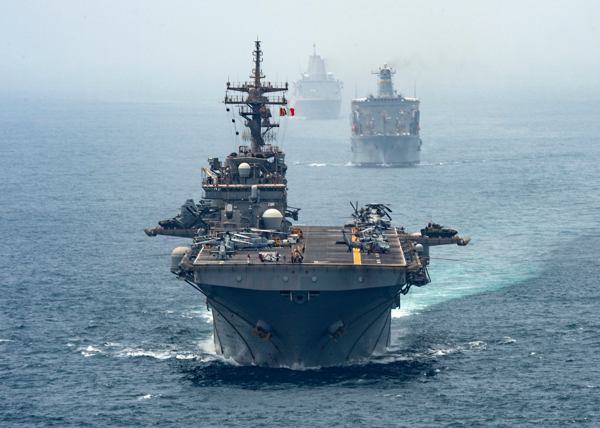 Amphibious assault ship USS Boxer (LHD 4), Fleet replenishment oiler ship USNS Tippecanoe (T-AO 199) and amphibious transport dock ship USS John P. Murtha (LPD 26) transit the Strait of Hormuz on Aug. 12, 2019.