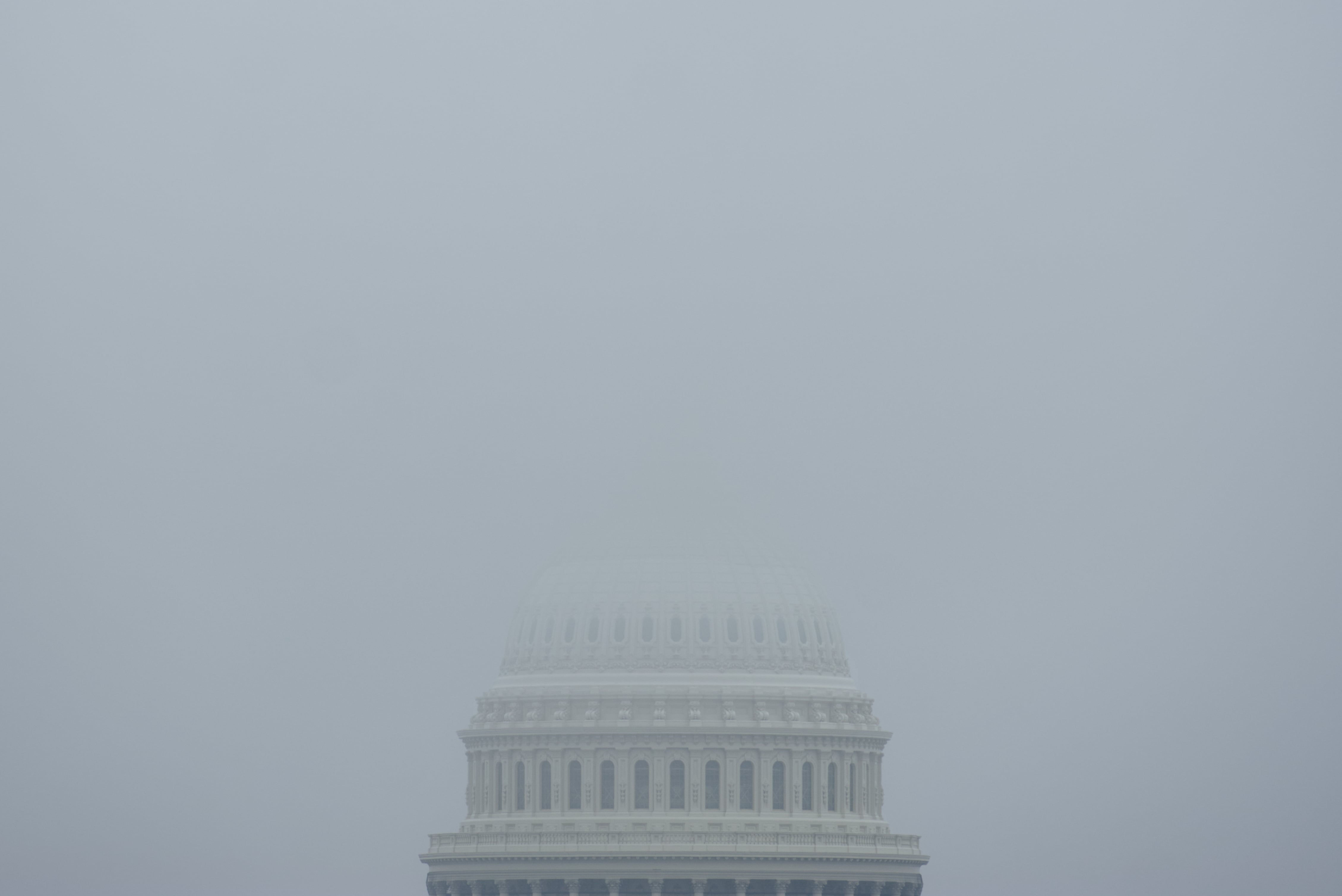 The top of the Capitol Dome in Washington, D.C., is obscured by fog Dec. 3, 2023.