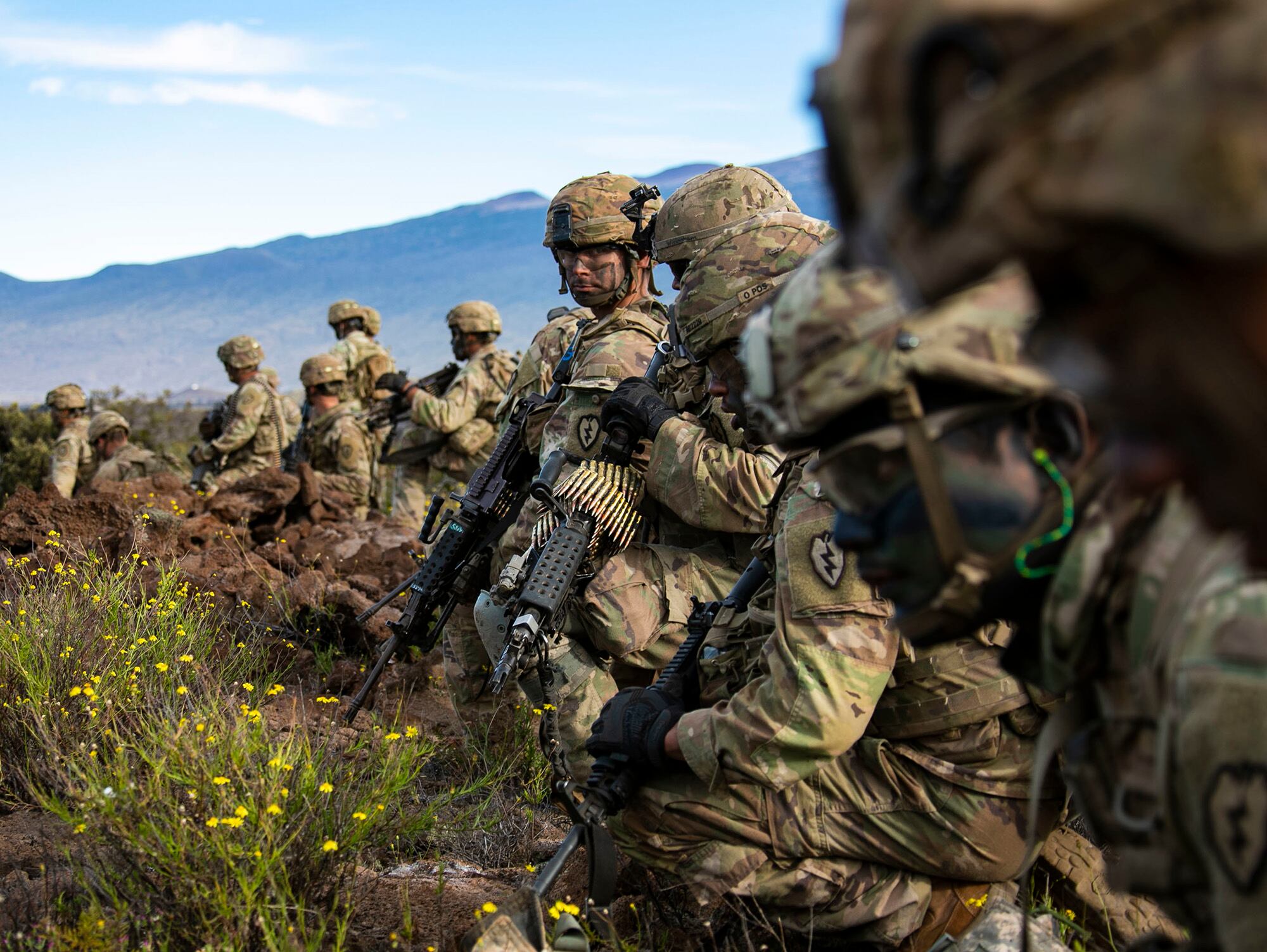 Soldiers with 2nd Squadron, 14th Cavalry Regiment, 2nd Infantry Brigade Combat Team, 25th Infantry Division get ready to bound forward during a fire support coordination exercise Nov. 19, 2019 at Pohakuloa Training Area on the island of Hawaii.