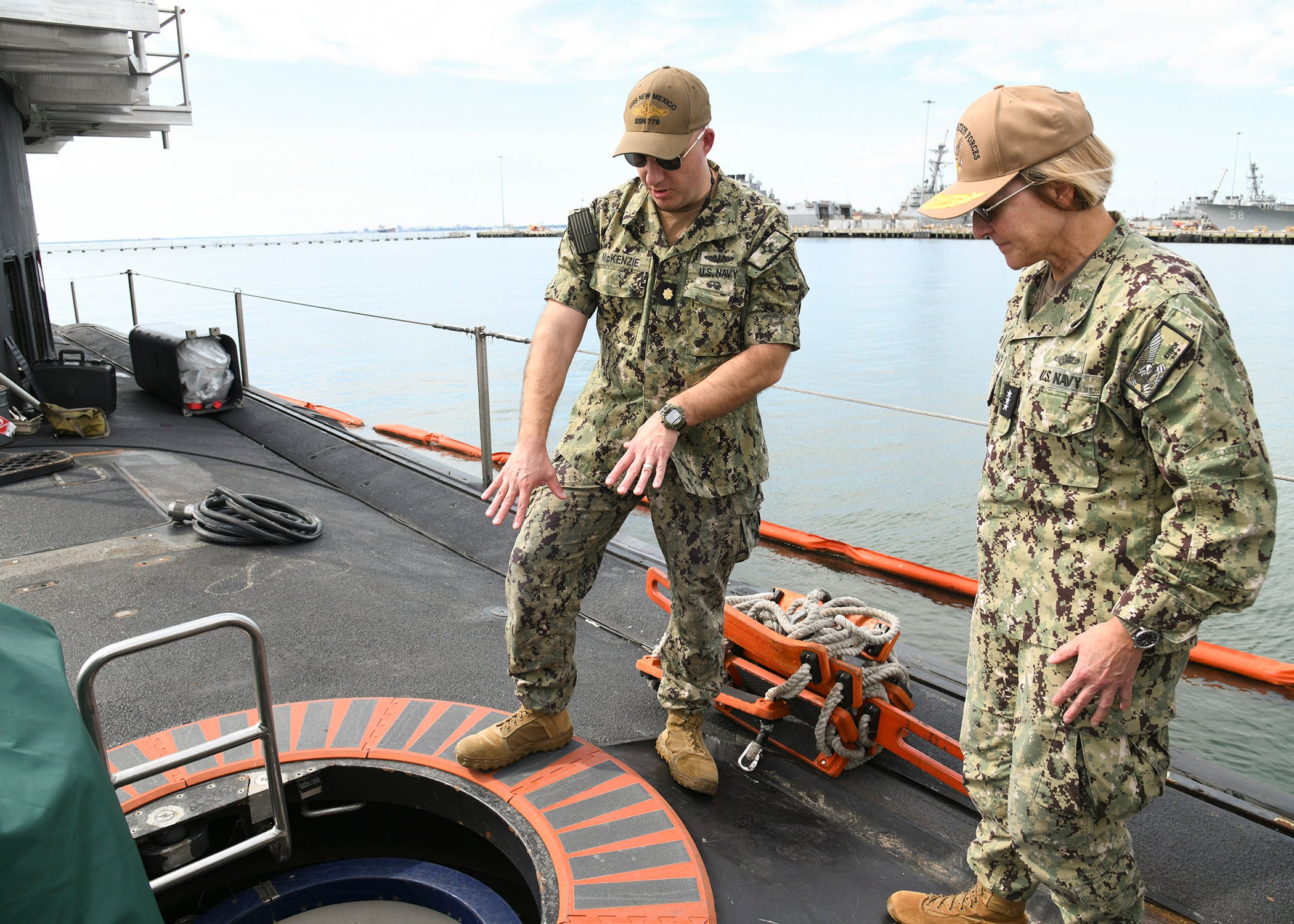 U.S. Navy Vice Adm. Kelly Aeschbach, the commander of Naval Information Forces, right, tours the Virginia-class attack submarine USS New Mexico.