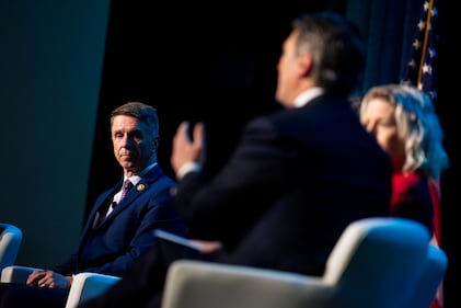 U.S. Rep. Rob Wittman, a Virginia Republican, listens to a fellow representative April 9, 2024, at the Sea-Air-Space naval conference.